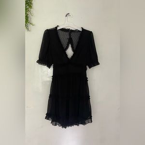 Fashion Nova Black Mini Dress Sz M Swiss Dot with a cutout in the back